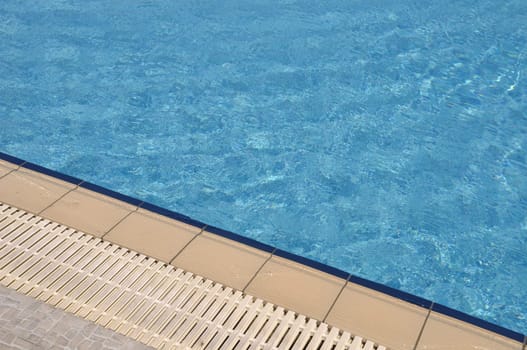 blue and vibrant swimming pool side