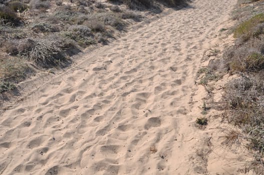 walkway over sand dunes to a beach in Kos island, Greece