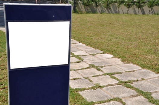 blank billboard and stone walkway in the park