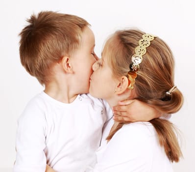 Kids giving a kiss to each other