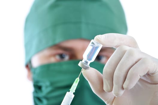 Doctor with syringe in hands, getting ready for injection isolated on white background