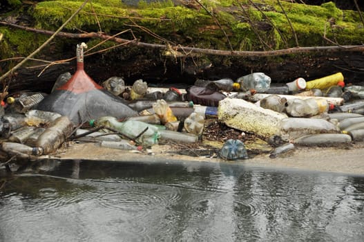 bottles and trash in the wild river