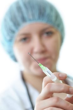 Nurse holding a syringe for injection