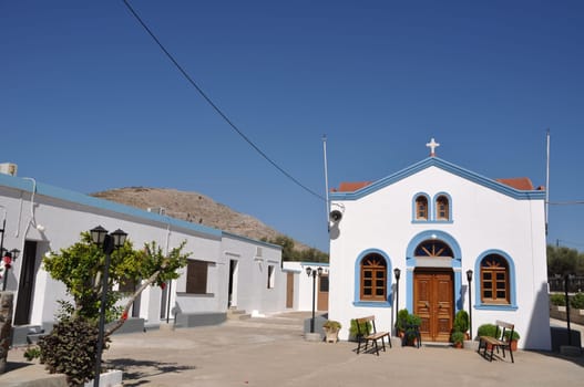 beautiful blue and white church in Pserimos island, Greece (gorgeous blue sky)