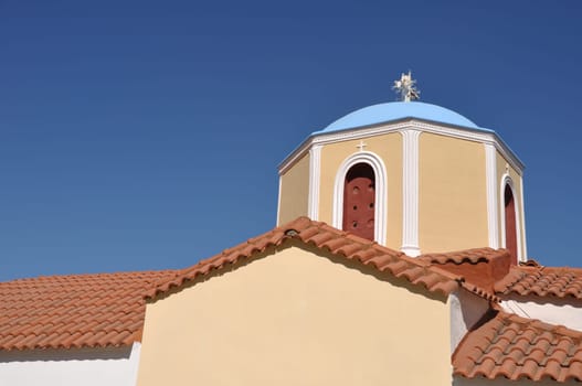 typical greek church in Zia village (Kos island), Greece (gorgeous blue sky)