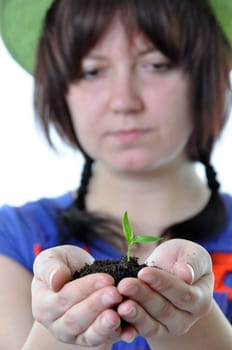 Gardener with plant in hands isolated on white background