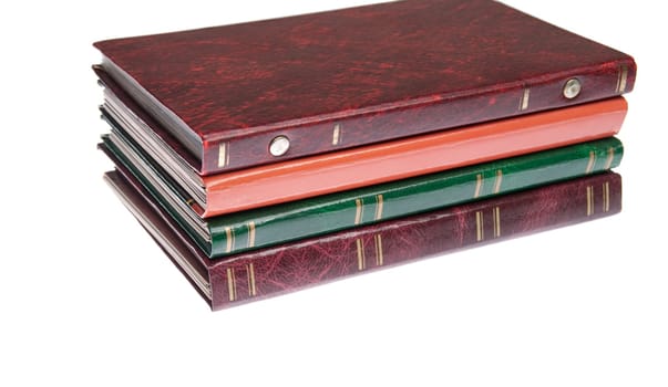pile of antique photo albums isolated on white background