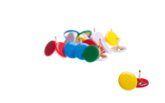 colored push pins isolated on white background (shallow depth of field)