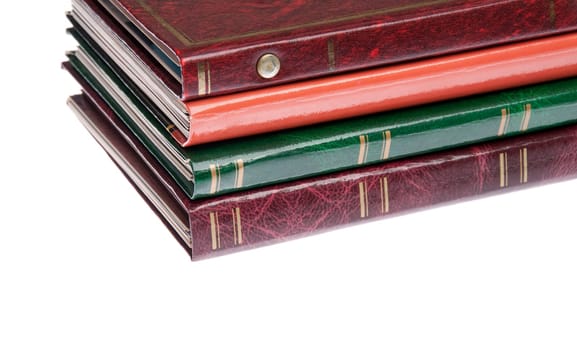 pile of antique photo albums isolated on white background