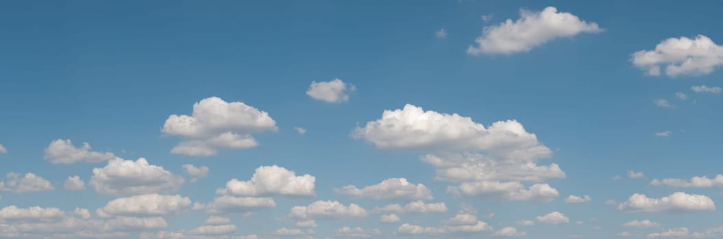 gorgeous white clouds in the blue sky (panoramic picture with copy-space at left top corner)