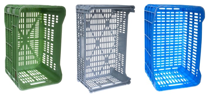 colorful fruits and vegetable plastic crates isolated on white background