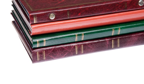 pile of antique photo albums isolated on white background