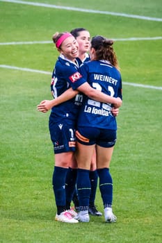 MELBOURNE, AUSTRALIA - OCTOBER 15: Melbourne Victory players celebrate McKenzie Weinert's goal before it is disallowed for offside against Brisbane Roar at La Trobe University Sports Fields on October 15, 2023 in Melbourne, Australia