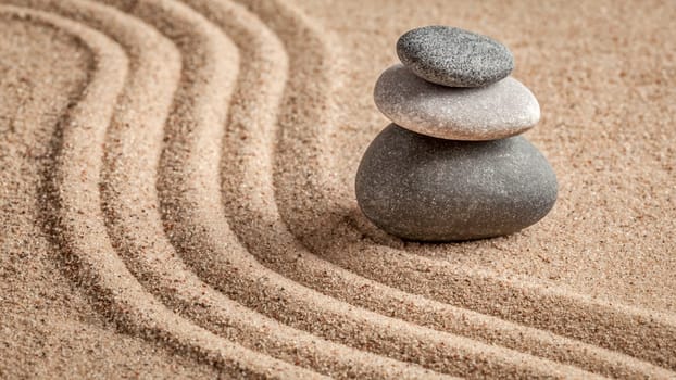 Japanese Zen stone garden - relaxation, meditation, simplicity and balance concept - panorama of pebbles and raked sand tranquil calm scene