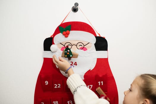 A girl find gifts Felt santa claus advent calendar