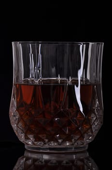 gorgeous glass of whisky on black background