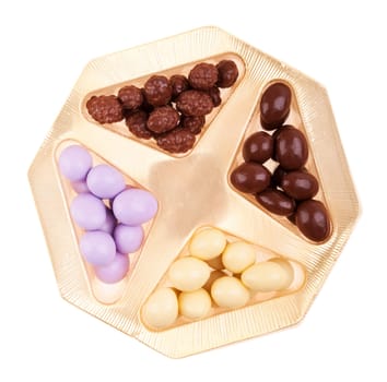 chocolate coated almonds and cereal (brown, purple, white) in a gorgeous box (isolated on white background)