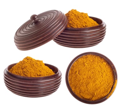 curry powder, mix of indian spices on a vintage wooden bowl (isolated on white background)