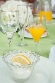 delicious lemon ice cream on a wedding table setting (it is served after the first dish in order to not mix taste between fish and meat plates)