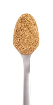 coriander spice on a stainless steel spoon, isolated on white background