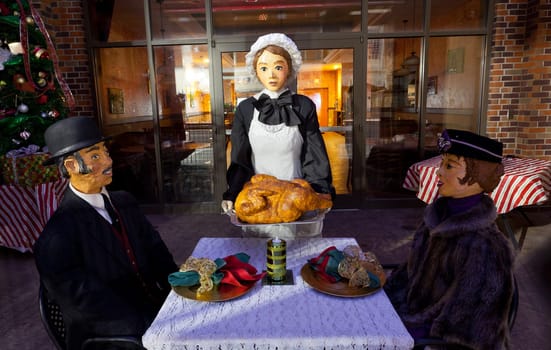 CAMBRIDGE, OHIO - NOVEMBER 24: Christmas lunch outside a restaurant in Cambridge Ohio on November 24, 2011. This annual event uses Dickens characters on the main street.