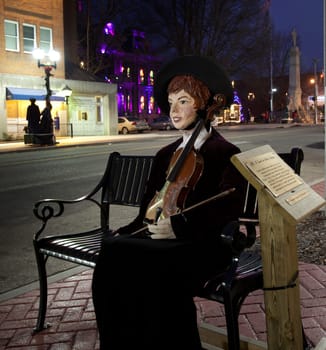 CAMBRIDGE, OHIO - NOVEMBER 24: Violinist in the high street in Cambridge Ohio on November 24, 2011. This annual event uses Dickens characters on the main street.