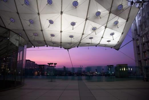 PARIS - SEPTEMBER 21: La Grande Arche in Paris at sunset. La Grande Arche is 110m high and was inagurated in July 1989