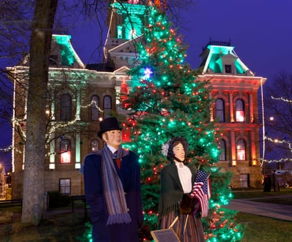 CAMBRIDGE, OHIO - NOVEMBER 24: Christmas lighting on the old Court House building in Cambridge Ohio on November 24, 2011. This annual event uses Dickens characters on the main street.