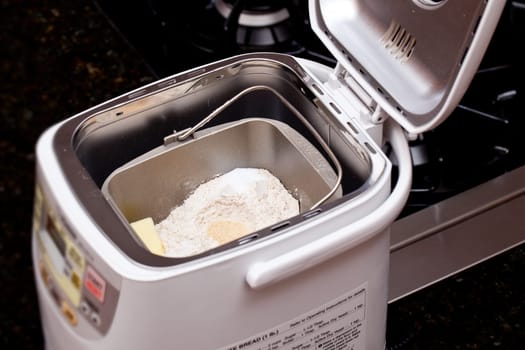 Bread making machine with ingredients prepared for mixing