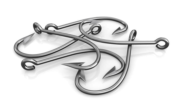 Few steel fishing hooks isolated on white background