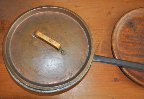 Detail of an ancient XIX century copper frying pan