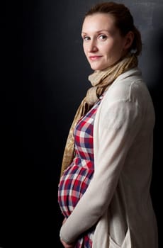 Portrait of a beautiful pregnant mother. Studio shot.