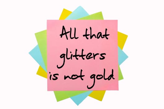 text "All that glitters is not gold"" written by hand font on bunch of colored sticky notes"