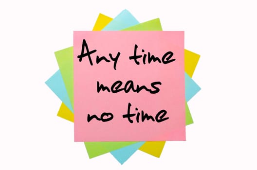 text "Any time means no time"" written by hand font on bunch of colored sticky notes"