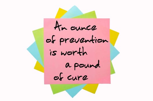 text "An ounce of prevention is worth a pound of cure"" written by hand font on bunch of colored sticky notes"