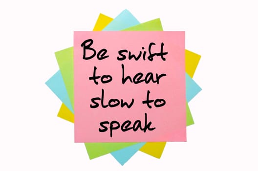 text "Be swift to hear, slow to speak"" written by hand font on bunch of colored sticky notes"