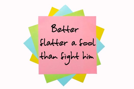 text "Better flatter a fool than fight him"" written by hand font on bunch of colored sticky notes"