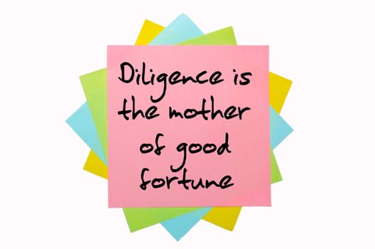text " Diligence is the mother of good fortune"" written by hand font on bunch of colored sticky notes"