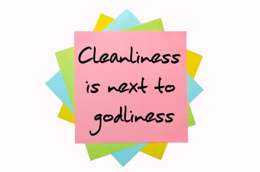 text "Cleanliness is next to godliness"" written by hand font on bunch of colored sticky notes"