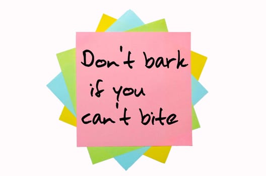 text "Don&#039 t bark if you can&#039 t bite"" written by hand font on bunch of colored sticky notes"