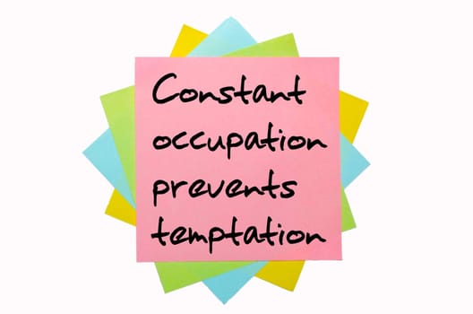 text "Constant occupation prevents temptation"" written by hand font on bunch of colored sticky notes"