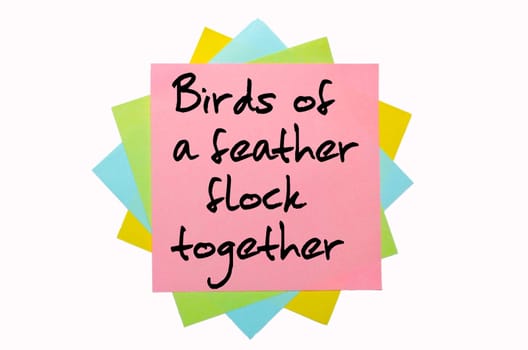 text "Birds of a feather flock together"" written by hand font on bunch of colored sticky notes"