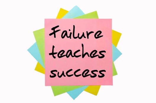 text "  Failure teaches success "" written by hand font on bunch of colored sticky notes"