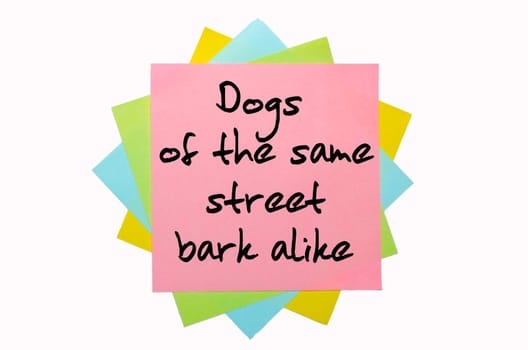 text "Dogs of the same street bark alike"" written by hand font on bunch of colored sticky notes"