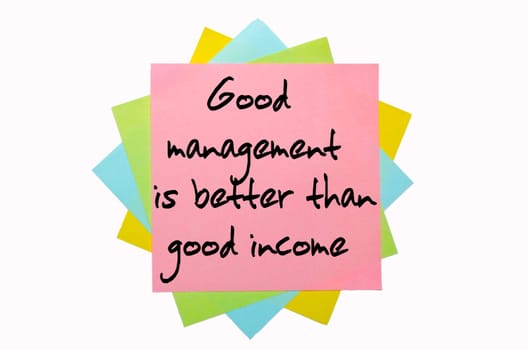 text "  Good management is better than good income "" written by hand font on bunch of colored sticky notes"
