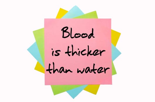 text "Blood is thicker than water"" written by hand font on bunch of colored sticky notes"