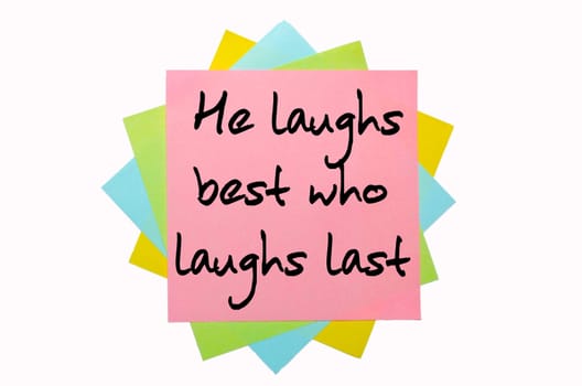 text "  He laughs best who laughs last "" written by hand font on bunch of colored sticky notes"