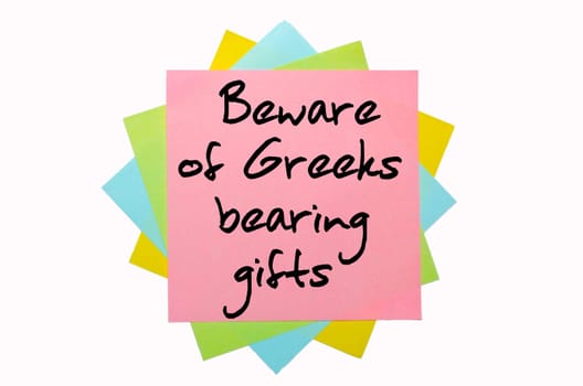 text "Beware of Greeks bearing giftst"" written by hand font on bunch of colored sticky notes"