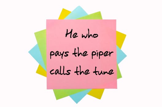 text "  He who pays the piper calls the tune "" written by hand font on bunch of colored sticky notes"