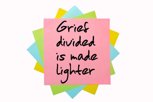 text "   Grief divided is made lighter "" written by hand font on bunch of colored sticky notes"